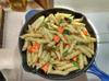 pasta dish with sauteed carrots, amaranth leaves, garlic, onion, oregano and thyme