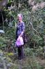 next photo: Tammy with bag of collected trash from along the trail