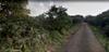 next photo: Google Streetview capture, road-looking east along the road, Feb 2012